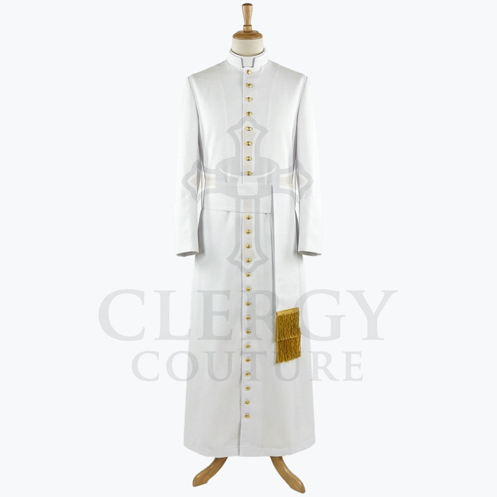 Front view of a white clergy cassock robe with a full-length gold button placket and a gold fringed tassel at the waist.