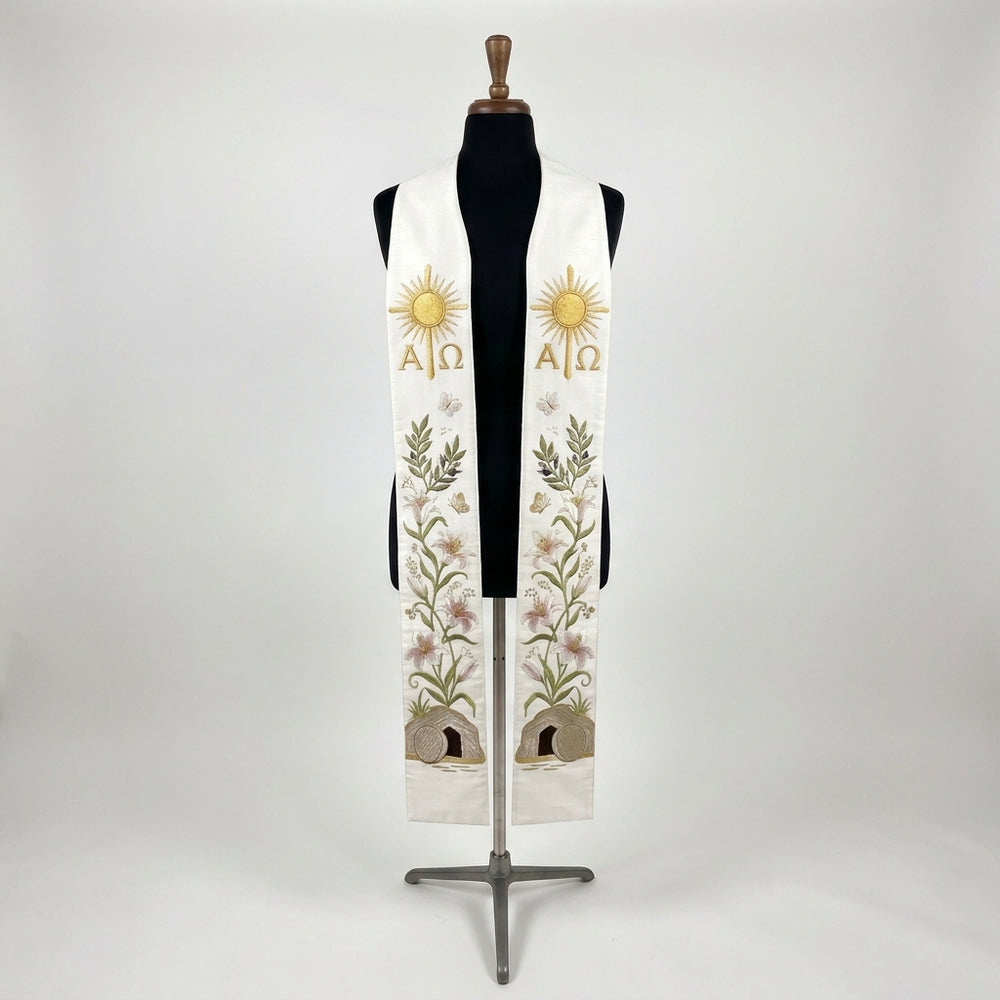 Front view of the White Easter Resurrection Stole, showing the gold Alpha and Omega sunburst, lily vine and empty tomb.