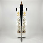 Front view of the White Easter Resurrection Stole, showing the gold Alpha and Omega sunburst, lily vine and empty tomb.