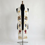 Front view of the White and Gold Epiphany Stole, showing the star, treasure chest, censer, urn and camel caravan sequence.
