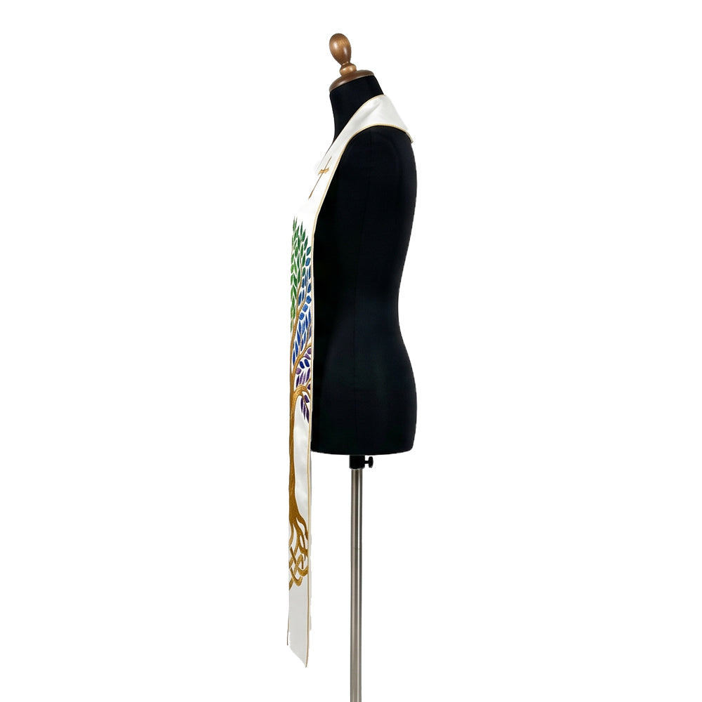 Close view of one white stole panel, showing the gold trunk branching into rainbow-coloured leaf clusters near the collar.