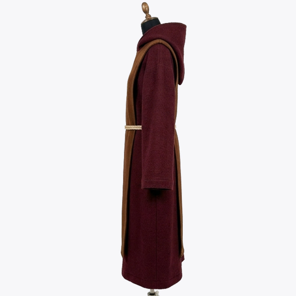 Side profile of the wine red habit showing the rust scapular edge and the rope cincture's knotted tail